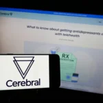 A_smartphone_and_a_computer_monitor_show_the_Cerebral_logo_representing_the_U.S._governments_lawsuit_against_the_company._