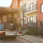 A_White_Moving_Truck_Outside_an_Apartment_Building_Represents_a_Brooklyn-based_Moving_Company_Which_Prosectors_Say_Bilked_Customers_Out_of_3_Million_By_Holding_Their_Possessions_Hostage_The_Daily_Muck