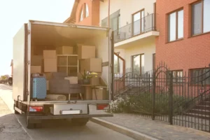 A_White_Moving_Truck_Outside_an_Apartment_Building_Represents_a_Brooklyn-based_Moving_Company_Which_Prosectors_Say_Bilked_Customers_Out_of_3_Million_By_Holding_Their_Possessions_Hostage_The_Daily_Muck