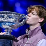 Jannik_Sinner_kisses_a_trophy_he_won_in_the_Australian_Open._He_claims_to_have_tested_positive_for_anabolic_steroids_due_to_the_fingers_of_his_massage_therapist_The_Daily_Muck