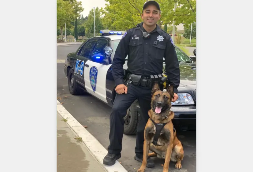 Morteza_Amiri_Poses_With_His_Police_Dog._Amiri_Is_Accused_of_Fraud_and_Excessive_Force_The_Daily_Muck