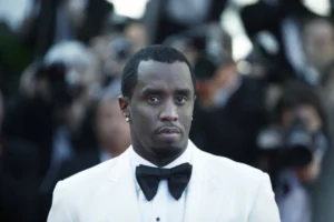 Sean_Combs_aka_Diddy_Puff_Daddy_Wears_a_Tuxedo_and_Looks_Somberly_at_the_Camera_a_Federal_Jury_Has_Indicted_Him_on_Three_Counts_So_Far_The_Daily_Muck