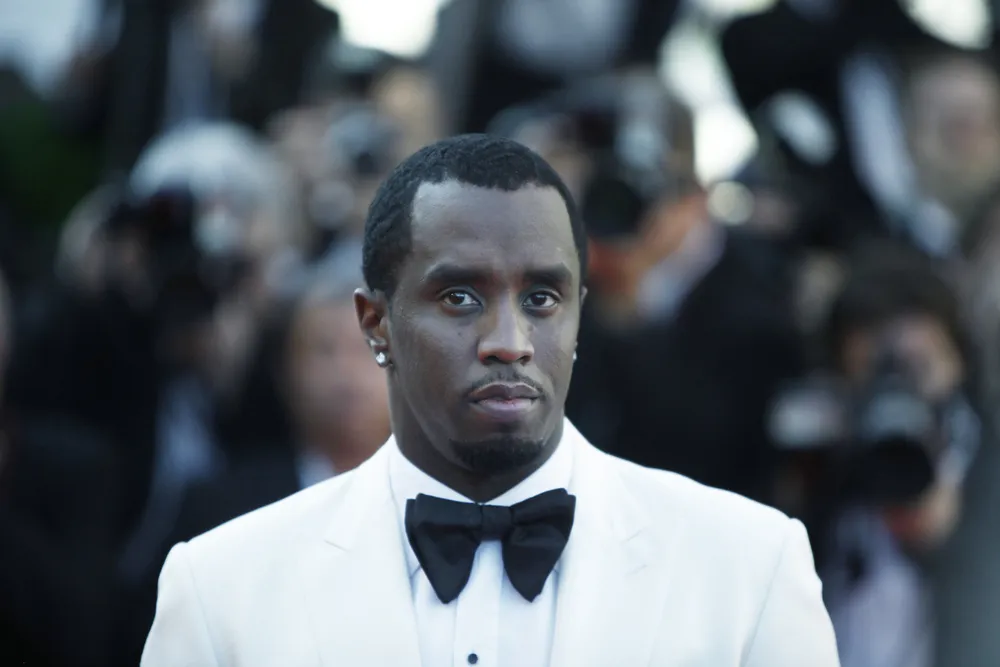 Sean_Combs_aka_Diddy_Puff_Daddy_Wears_a_Tuxedo_and_Looks_Somberly_at_the_Camera_a_Federal_Jury_Has_Indicted_Him_on_Three_Counts_So_Far_The_Daily_Muck