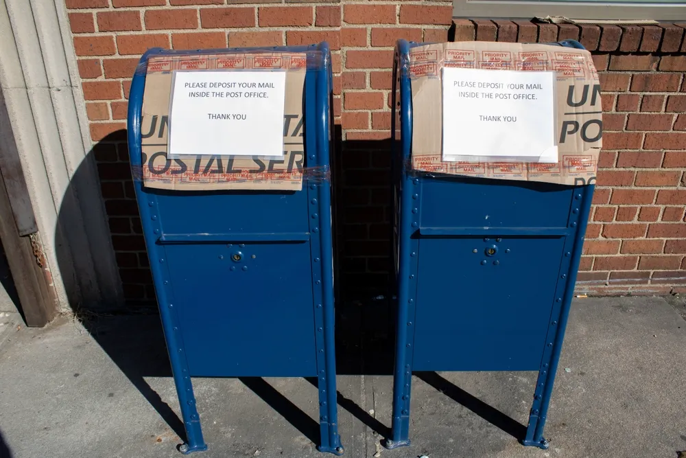 Two_closed_post_office_boxes_represent_Kenshaun_Thompson_and_Adam_Bekele_are_guilty_of_federal_charges_involving_stolen_mail_The_Daily_Muck