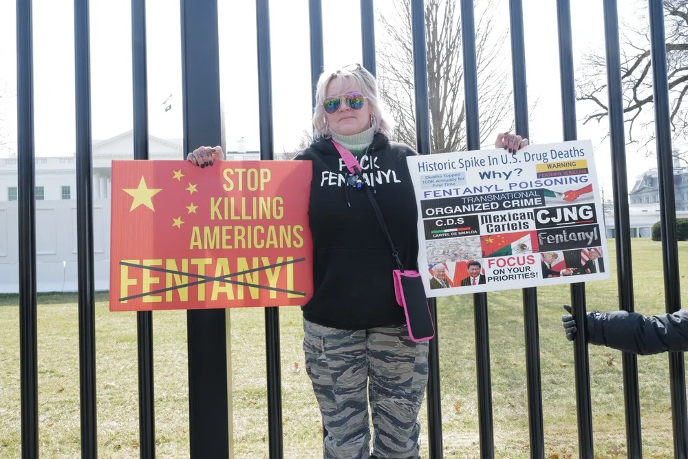 A Woman Protests Against Chinese Fentanyl at a Protest at the White House in 2022 - The Daily Muck