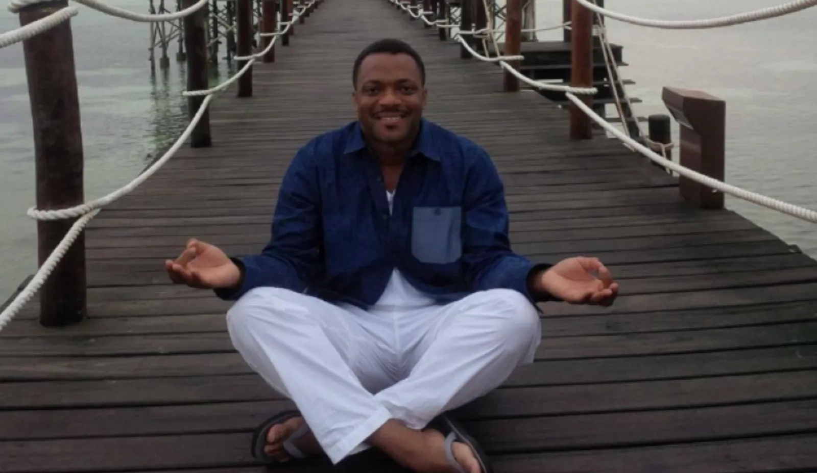 Bobby Shumake Japhia aka Robert Shumake Jr. Sits Cross-Legged on a Dock in a Press Release Promoting His Businesses - The Daily Muck