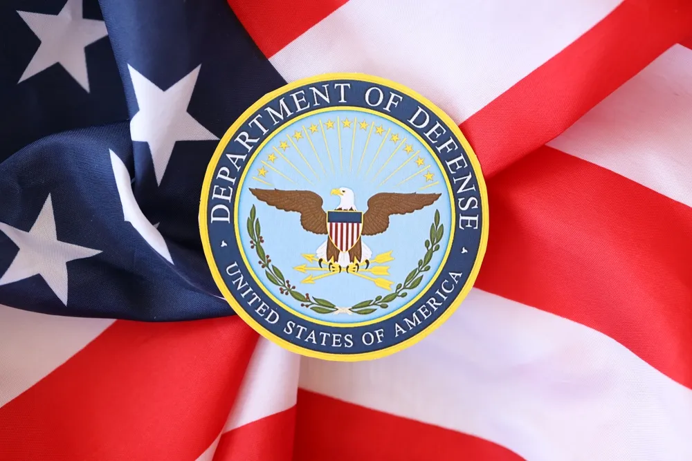 The DOD Seal on Top of an American Flag Represents the Theft of Classified Material By Margaret Ashby Who Pleaded Guilty on Oct. 23. - The Daily Muck