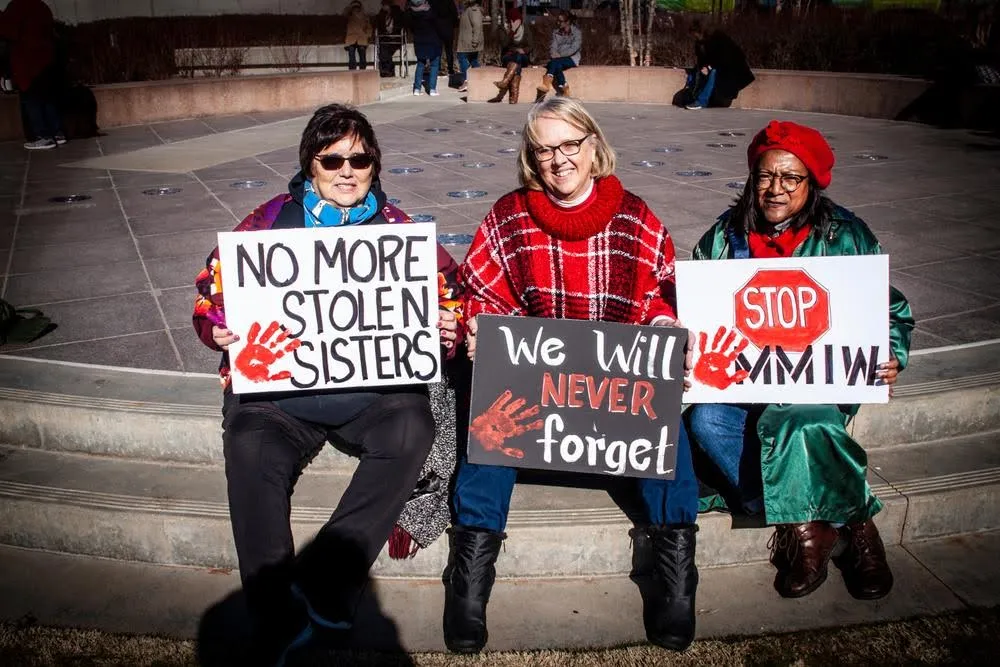 At another demonstration in Tulsa, Okla., three women hold up signs memorializing Missing and Murdered Indigenous Women