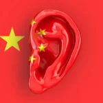 A_Human_Ear_Superimposed_Over_the_Image_of_a_Chineese_Flag_Represents_the_Efforts_of_Chinese_Officials_to_Surrepticiously_Gather_Information_From_Unregistered_Agents_in_the_United_States