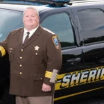 Former_Culpeper_County_Sheriff_Scott_Howard_Jenkins_Poses_Next_to_a_Cruiser_As_He_Was_Reelected_For_the_Third_Time_in_2019