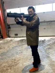 Yakiza_Leader_Takeshi_Ebisawa_Guilty_of_International_Arms_Trafficking_Charges_Holds_a_Bazooka_Pretending_to_Shoot_it_in_an_Undated_Photgraph
